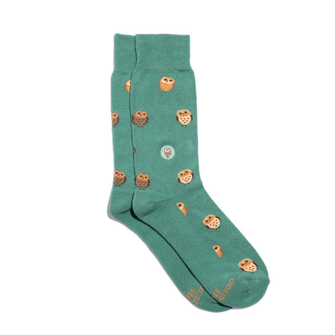 Conscious Step green crew socks with owls on a white background