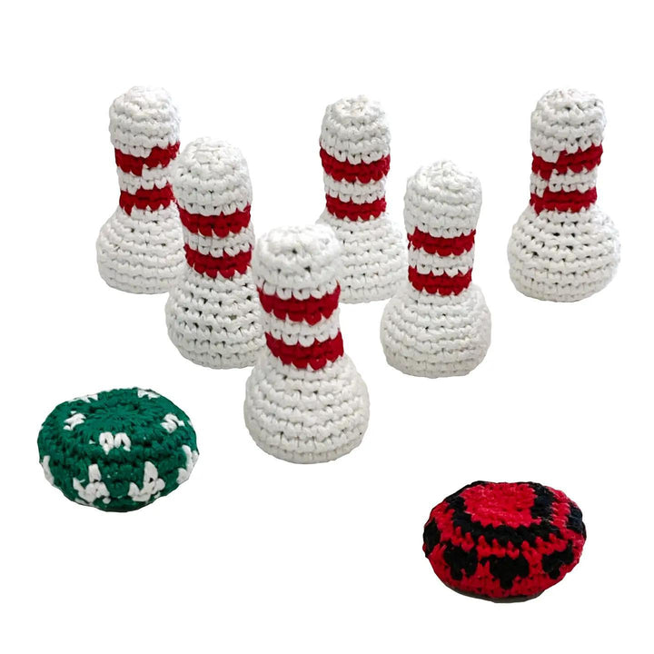 Set of crocheted bowling pins and balls on a white background