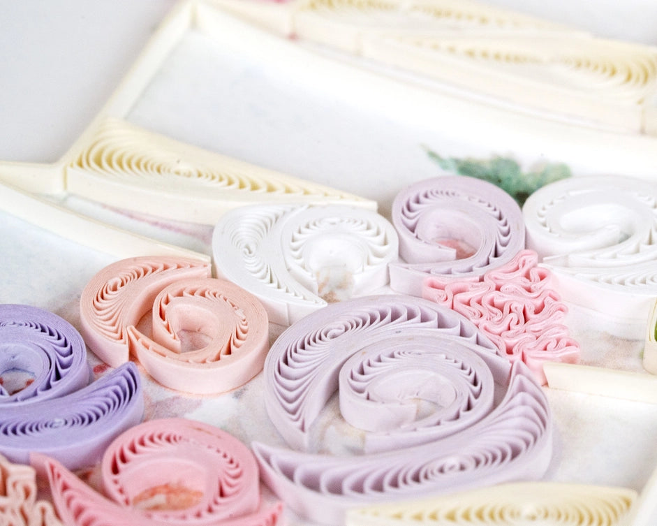 Close-up of colorful paper rolls arranged in a decorative pattern.