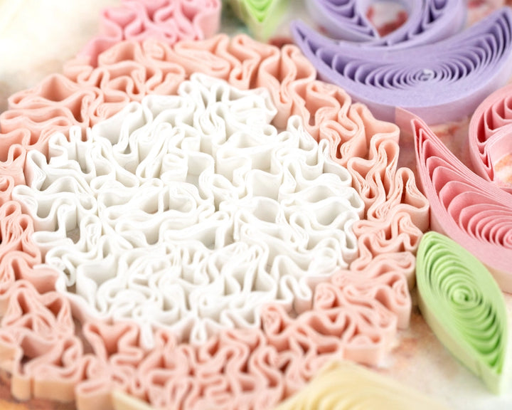 Close-up of colorful rolled fondant on a white background