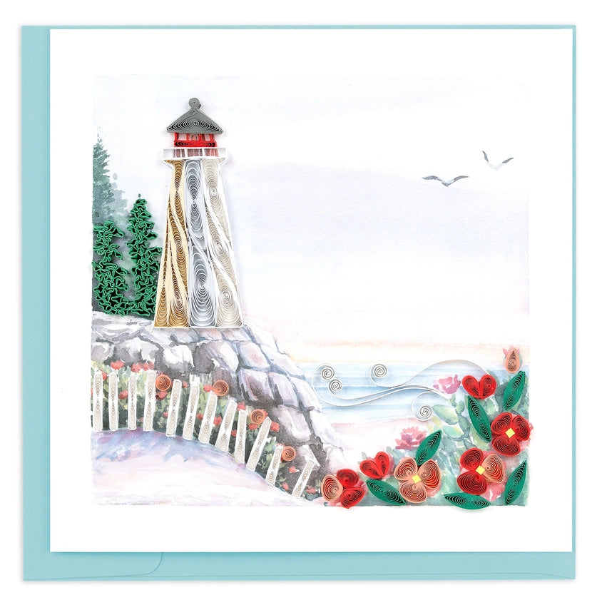 Lighthouse scene with flowers and a fence on a snowy background on a quilling card