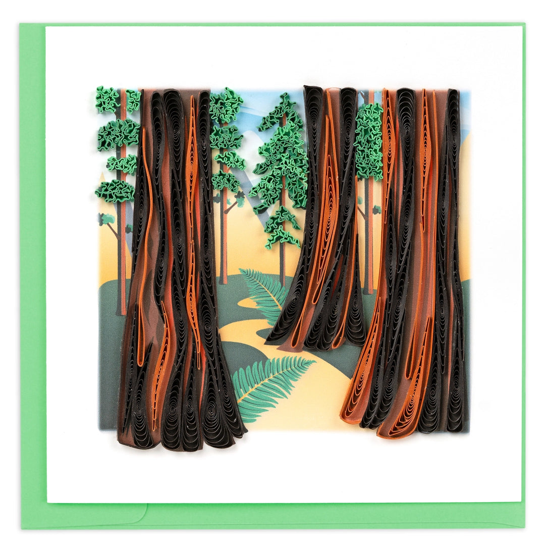 Quilled card with a forest design featuring tall trees and a path.