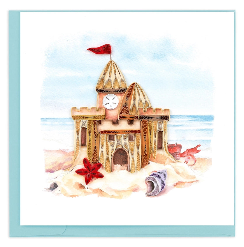 Illustration of a sandcastle with seashells and a starfish on a beach on a quilled card.