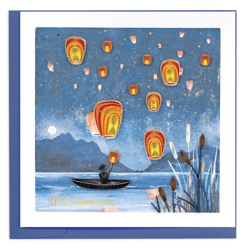 Quilling Card with a person in a boat releasing lanterns into a night sky over water.