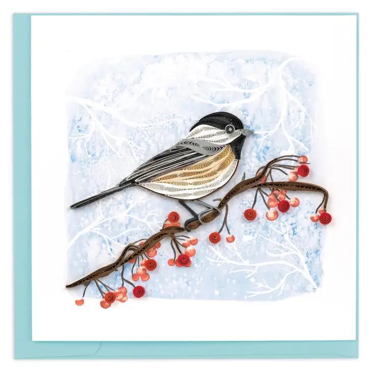 A quilled greeting card featuring a winter chickadee perched on a branch with red berries, set against a snowy background.