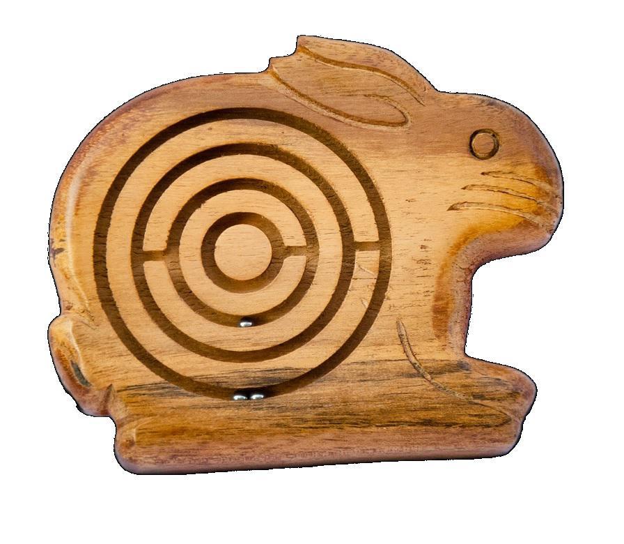 Hand-carved wooden puzzle in the shape of a rabbit with a circular maze design.