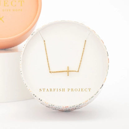 gold cross necklace design and 'Starfish Project' branding on a light background
