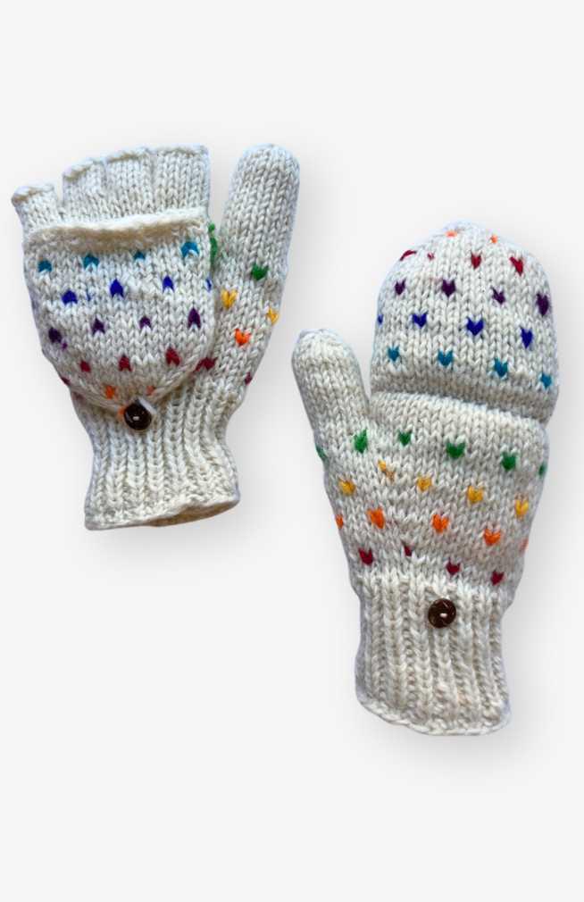 Pair of knitted mittens with rainbow heart patterns on a white background