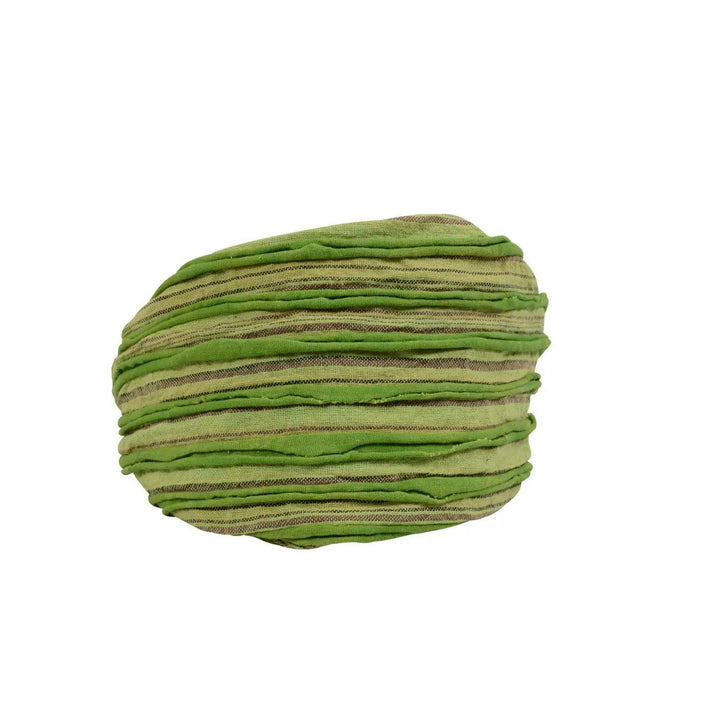 A headband with a razor cut style, featuring shades of green and brown.