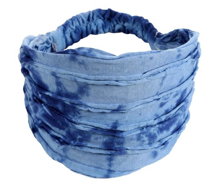A headband with a razor cut style, featuring shades of blue.
