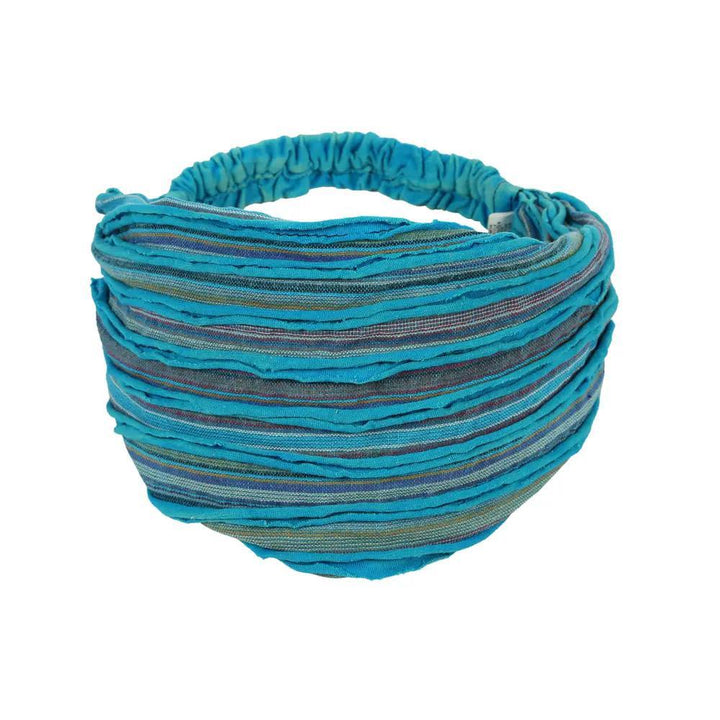 A bright blue razor cut headband with stripes of different colors.