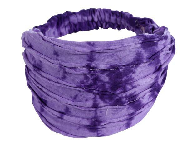 A purple headband with a razor cut style.