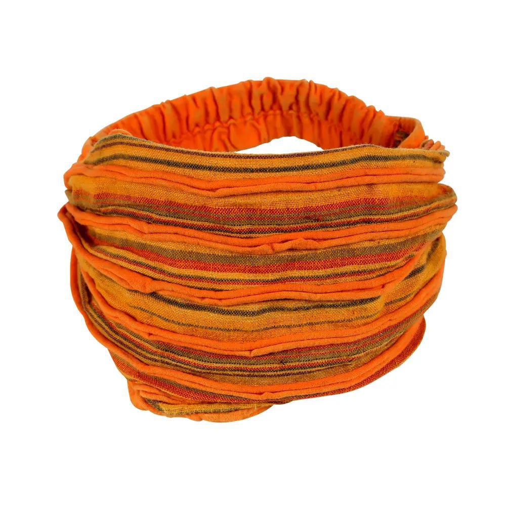 An orange headband with a razor cut style, featuring shades of green and brown.
