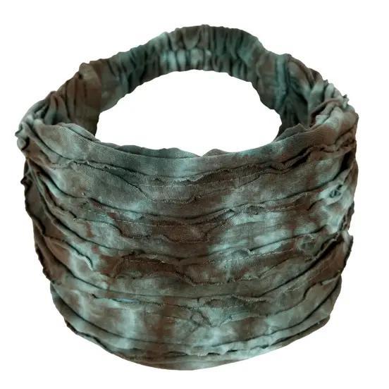 A gray and black striped razor cut headband, displayed in an open circle shape.