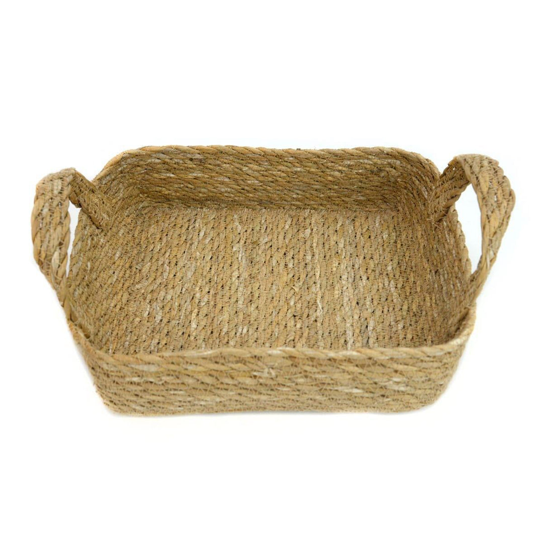 Woven basket with handles on a white background
