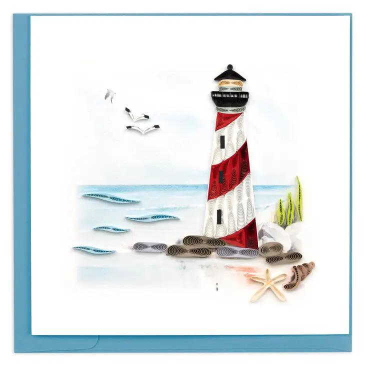 A red and white lighthouse quilling card with a blue envelope 