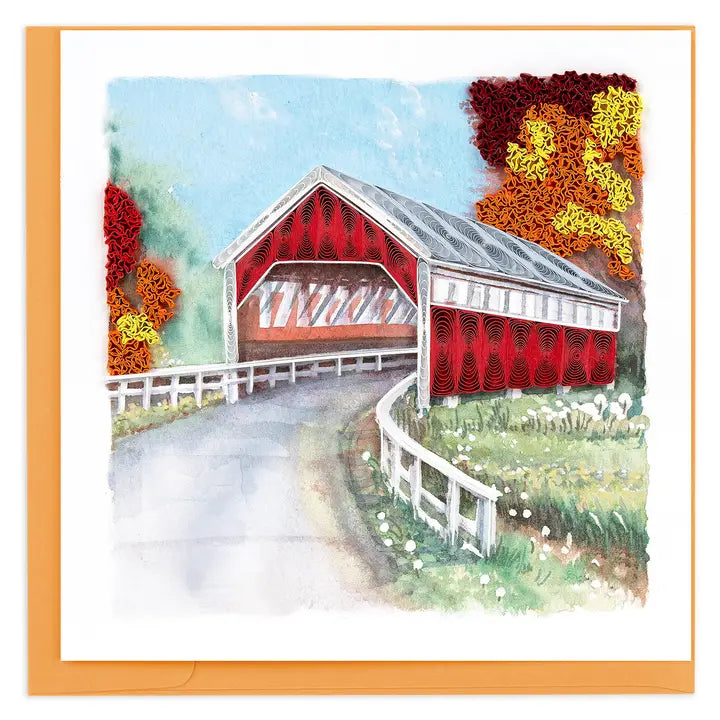 Illustration of a red covered bridge with autumn foliage 