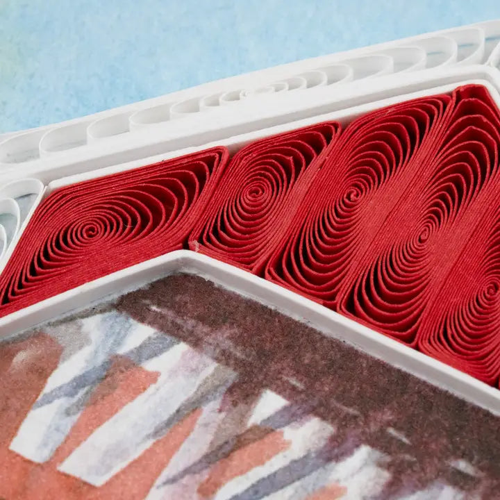 Red rolls of paper close up of a greeting card