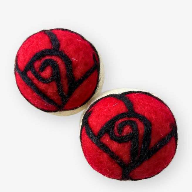 Red rose dryer balls on a white background