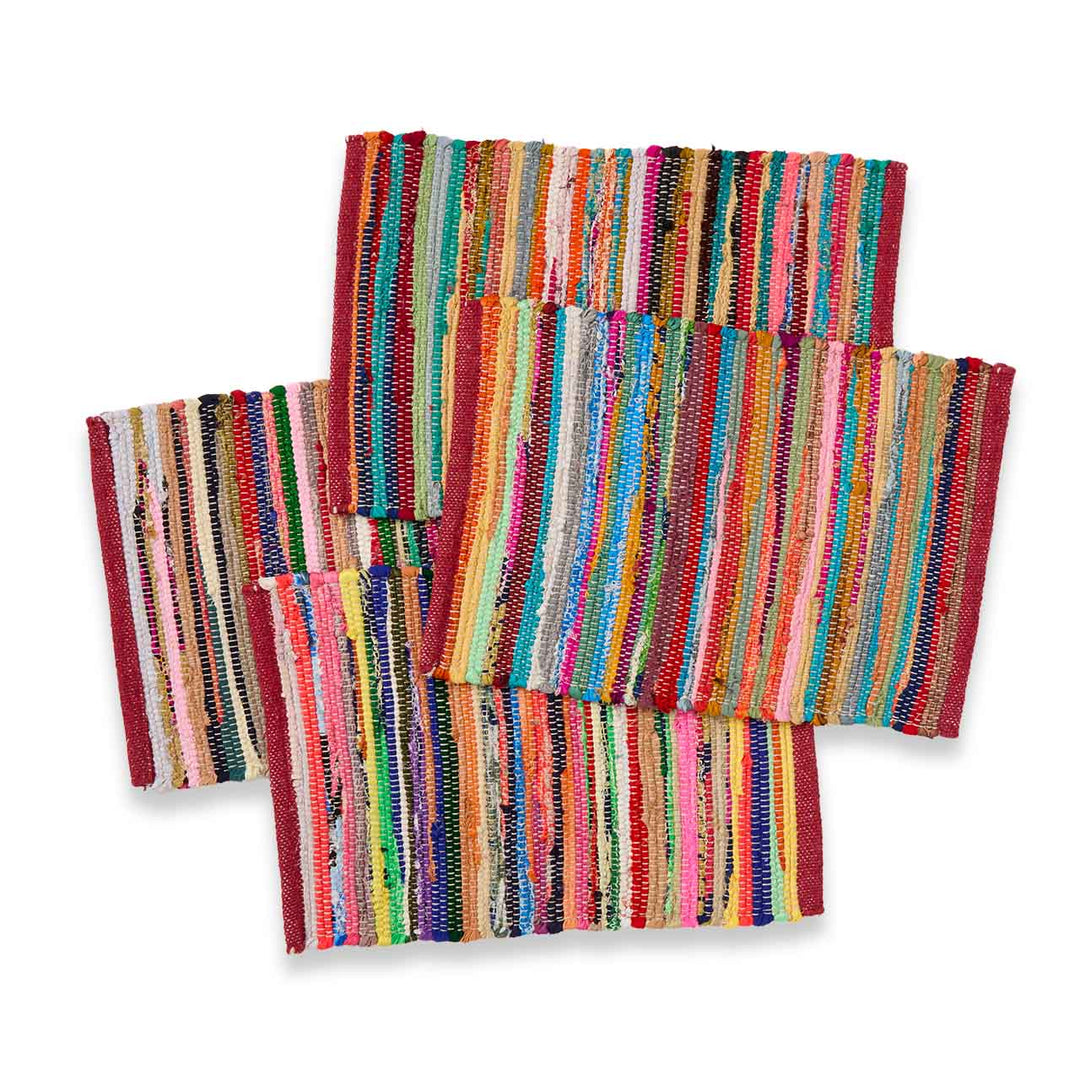 Set of colorful striped placemats on a white background