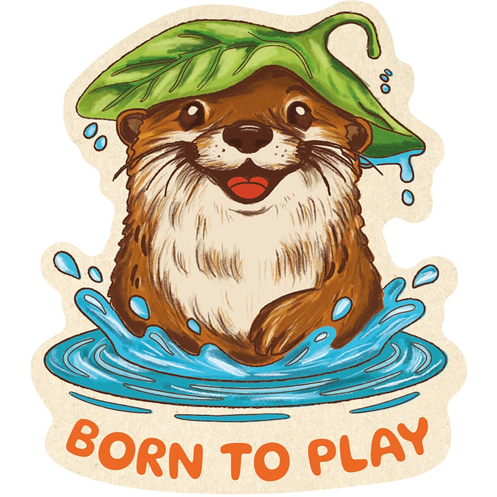 A die-cut sticker featuring a cartoon otter sitting in blue water with a green leaf on its head and the text 'BORN TO PLAY' at the bottom, shown on a plain white background.