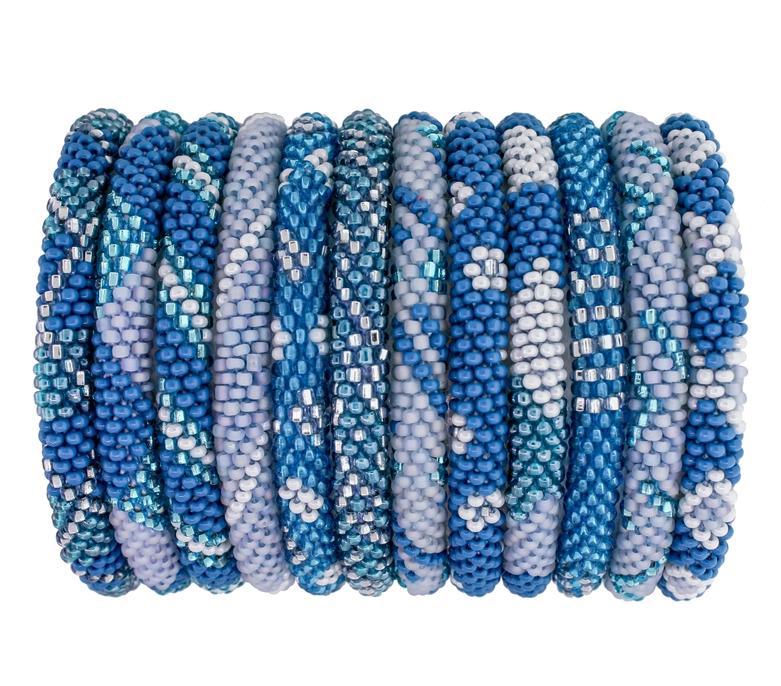 Beaded roll-on bracelets with blue patterns and shades displayed on a roll.
