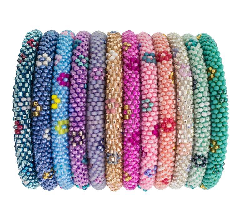 A collection of colorful bracelets made with high-quality glass beads and hand-dyed cotton thread, featuring various colors and a flower pattern.