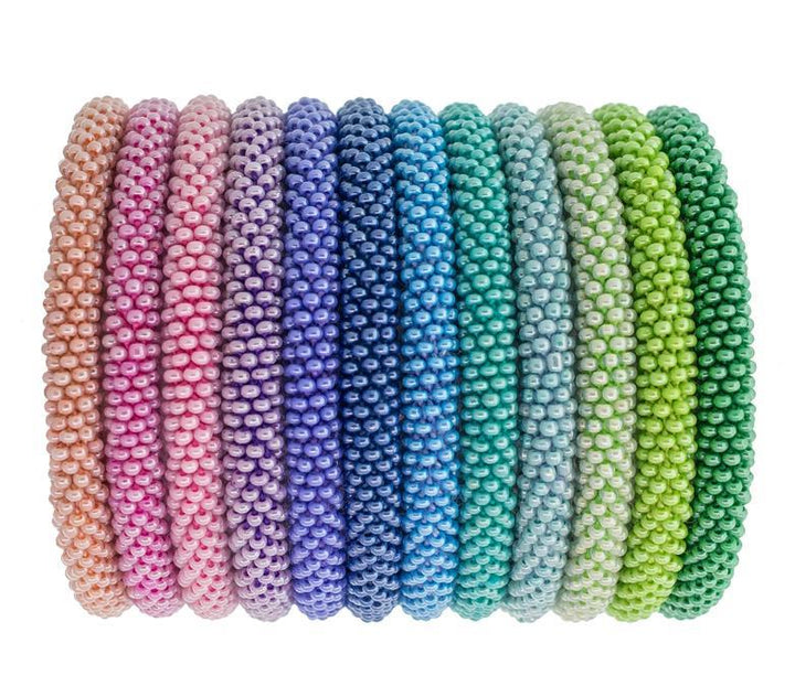 A series of multicolored bracelets made with high-quality glass beads and hand-dyed cotton thread, displayed on a white background.