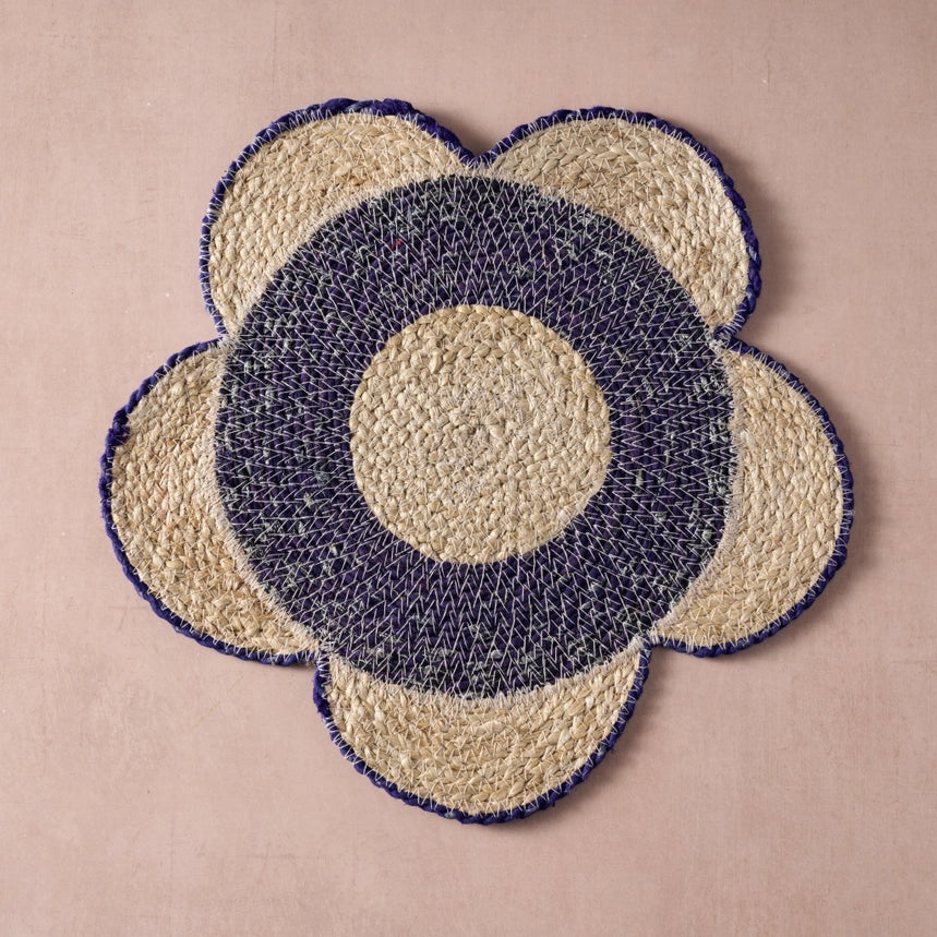 Floral-patterned woven placemat with concentric circle design on a beige background