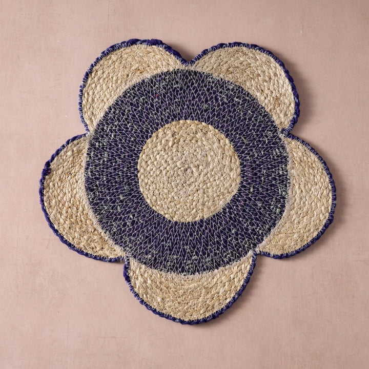 Floral-patterned woven placemat with concentric circle design on a beige background