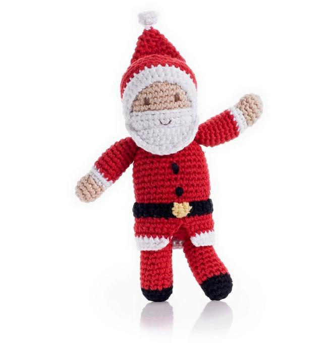 Hand knitted baby rattle in the shape of jolly old Santa Claus.