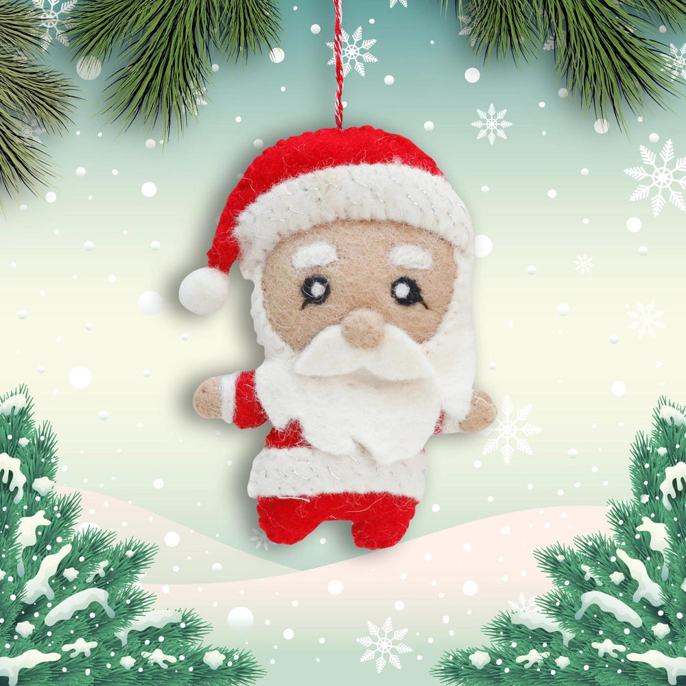 Felt Santa Claus ornament hanging against a snowy background with trees and snowflakes.