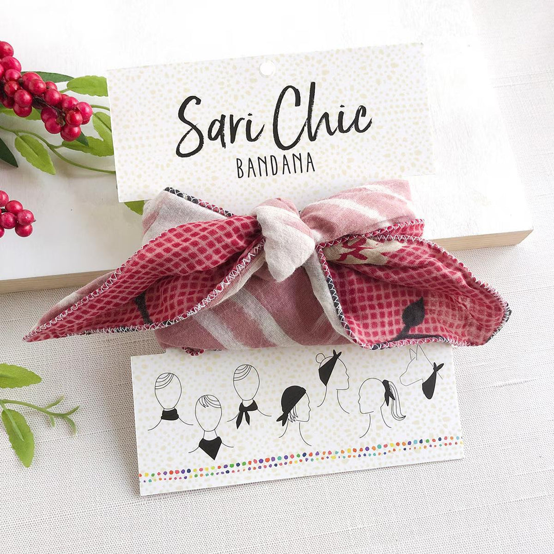 Sari Chic bandana with decorative card and berries on a light background
