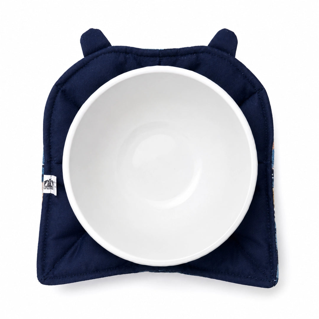 White bowl with a navy blue cover resembling a hood on a white background