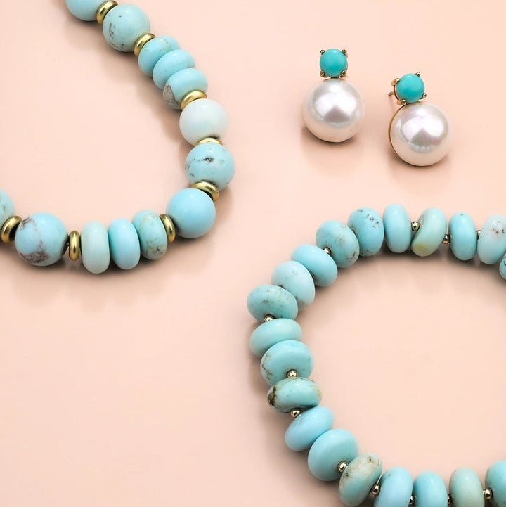 turquoise necklace on a pink background