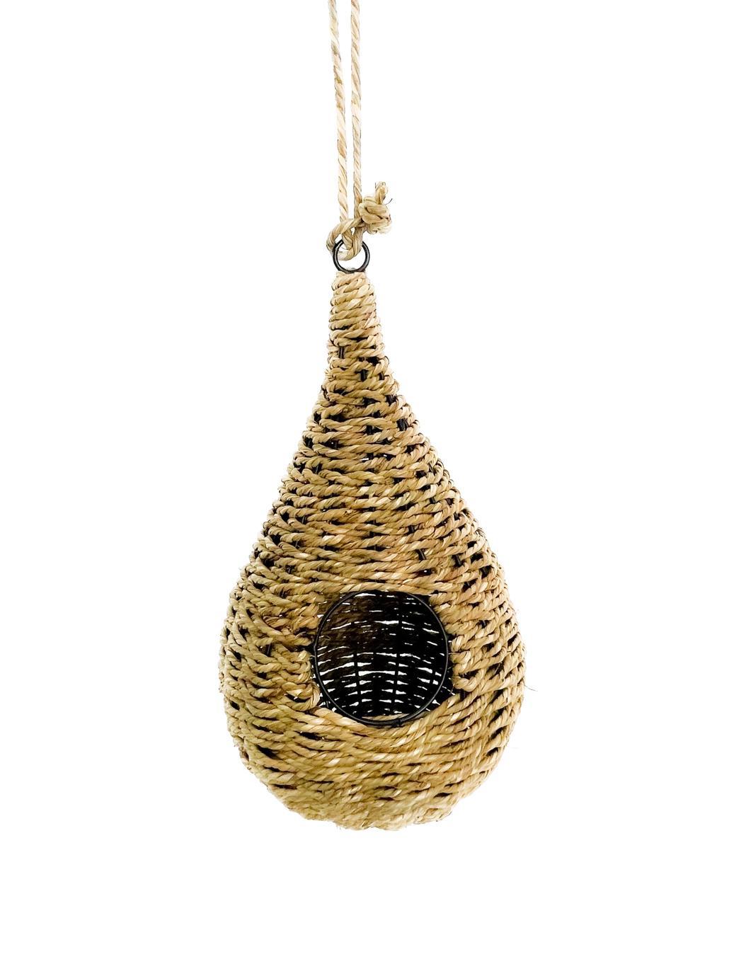 A teardrop-shaped birdhouse made of natural seagrass, with a visible metal framework inside, hanging from a loop at the top.