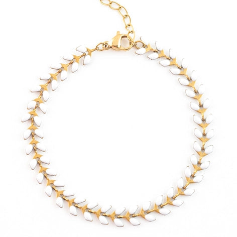 Gold and white bracelet on a white background