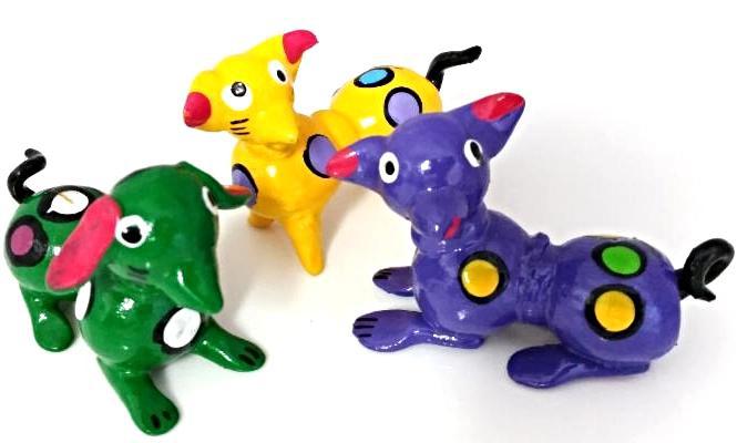 Small figurines resembling dogs made from gourds in Mexico.