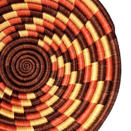 Hand-crafted basket with beautiful autumn colors, such as red, orange, and beige. 