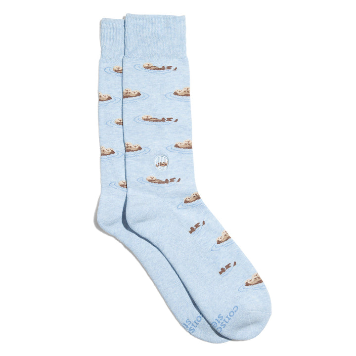 Light blue socks with sea otter pattern on a white background