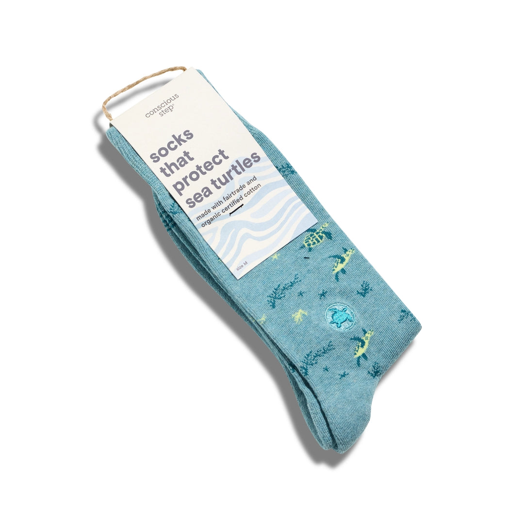 Blue socks with sea turtle design on a white background