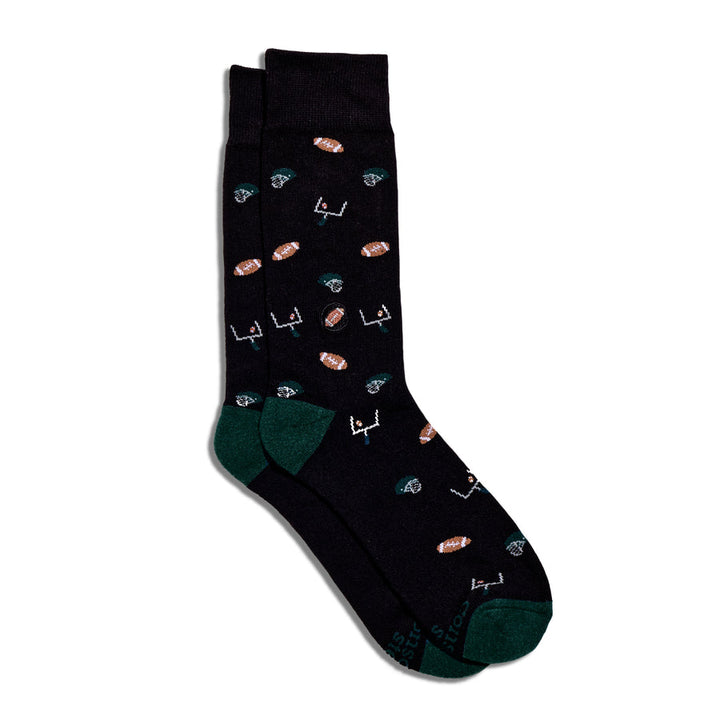 Black sock with colorful football themed designs on a white background