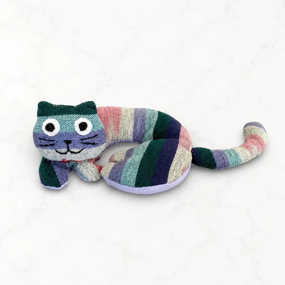 Striped cat-shaped coaster on a white background