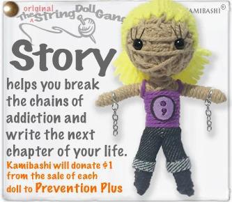 A handcrafted string doll with a purple outfit and chains on their arms. The doll is displayed with a nametag and has a keyring attachment.