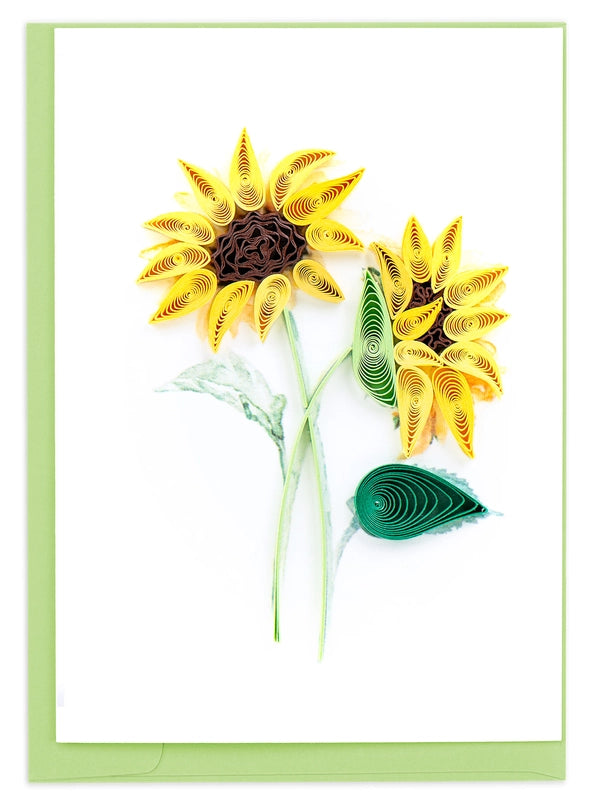 Quilled sunflower design on a white background with a green envelop 