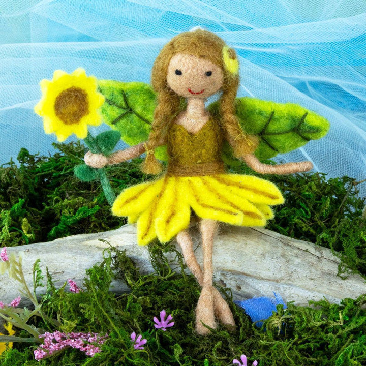 Felt fairy ornament with a sunflower on a natural background