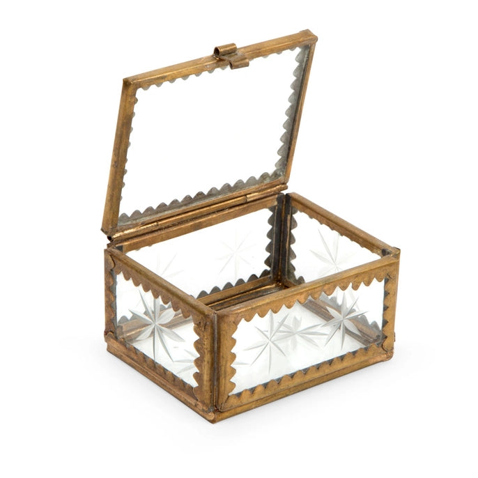 Decorative glass box with a metallic brass frame on a white background