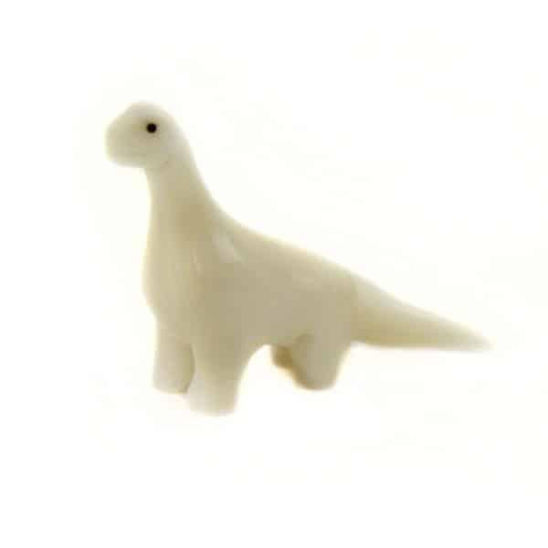 a hand carved tagua nut brontosaurus 