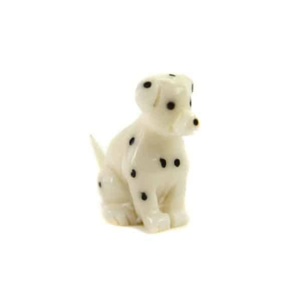 a tagua nut dalmatian on a white background