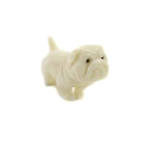 A tagua nut pug dog on a white background